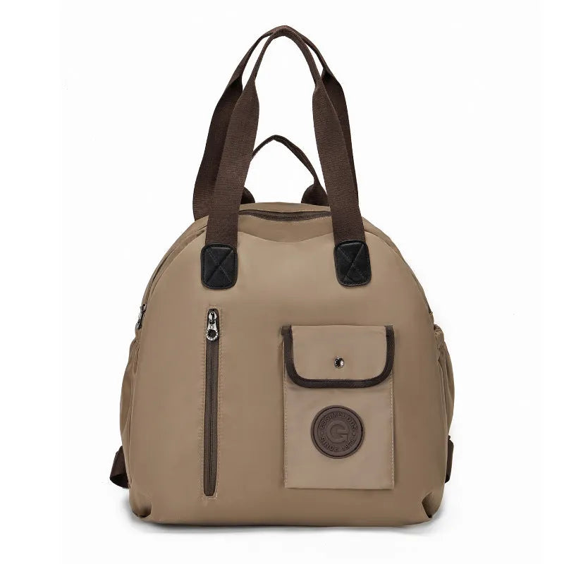 Large lightweight nylon backpack in black, shown with a sandwich pocket and main compartment.
