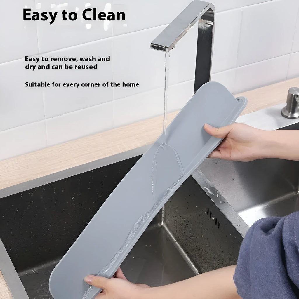 A thick grey silicone water blocking plate for a kitchen sink, showing its size and non-slip base.
