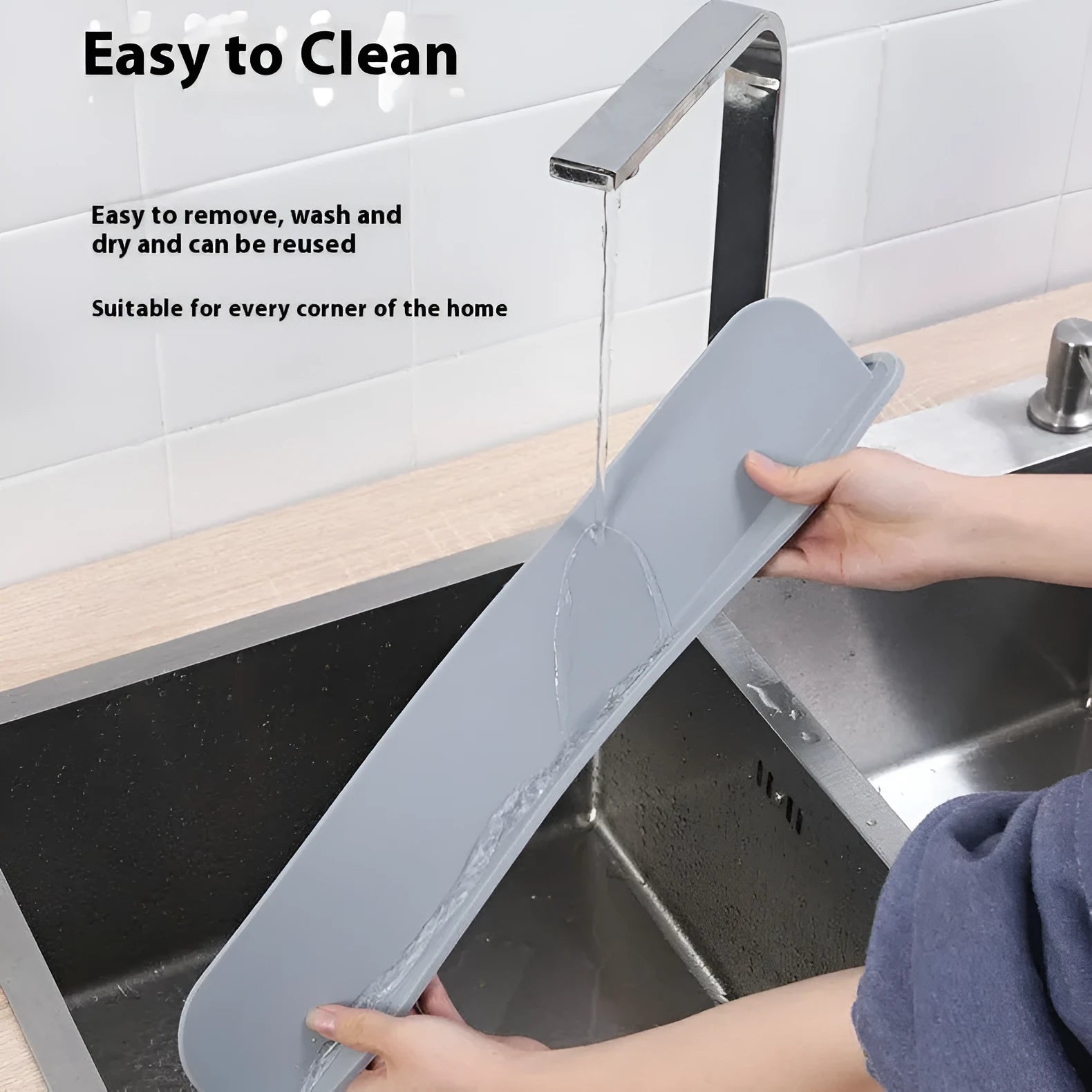 A thick grey silicone water blocking plate for a kitchen sink, showing its size and non-slip base.