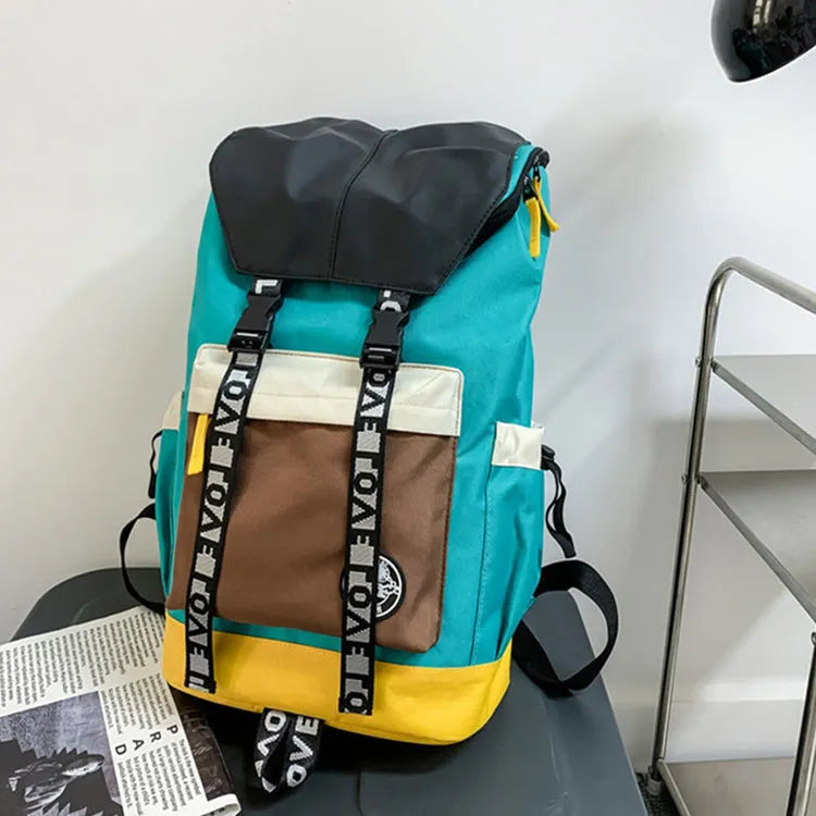 Oxford cloth backpack in black shown with handheld grip and shoulder straps.