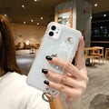 Transparent TPU mobile phone case for iPhone in purple, white, pink, green and black colours.