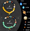 Set of two natural stone beaded bracelets for zodiac signs on a textured background.