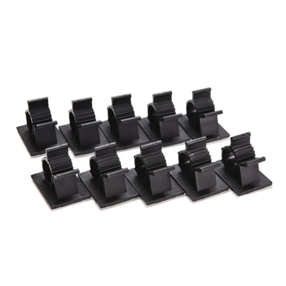 Ten black nylon adhesive cable clamps for wire management, shown with a cable inserted.