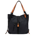 Soft canvas handbag with anti-theft device, curved shoulder strap, and digging bag outer pocket in black
