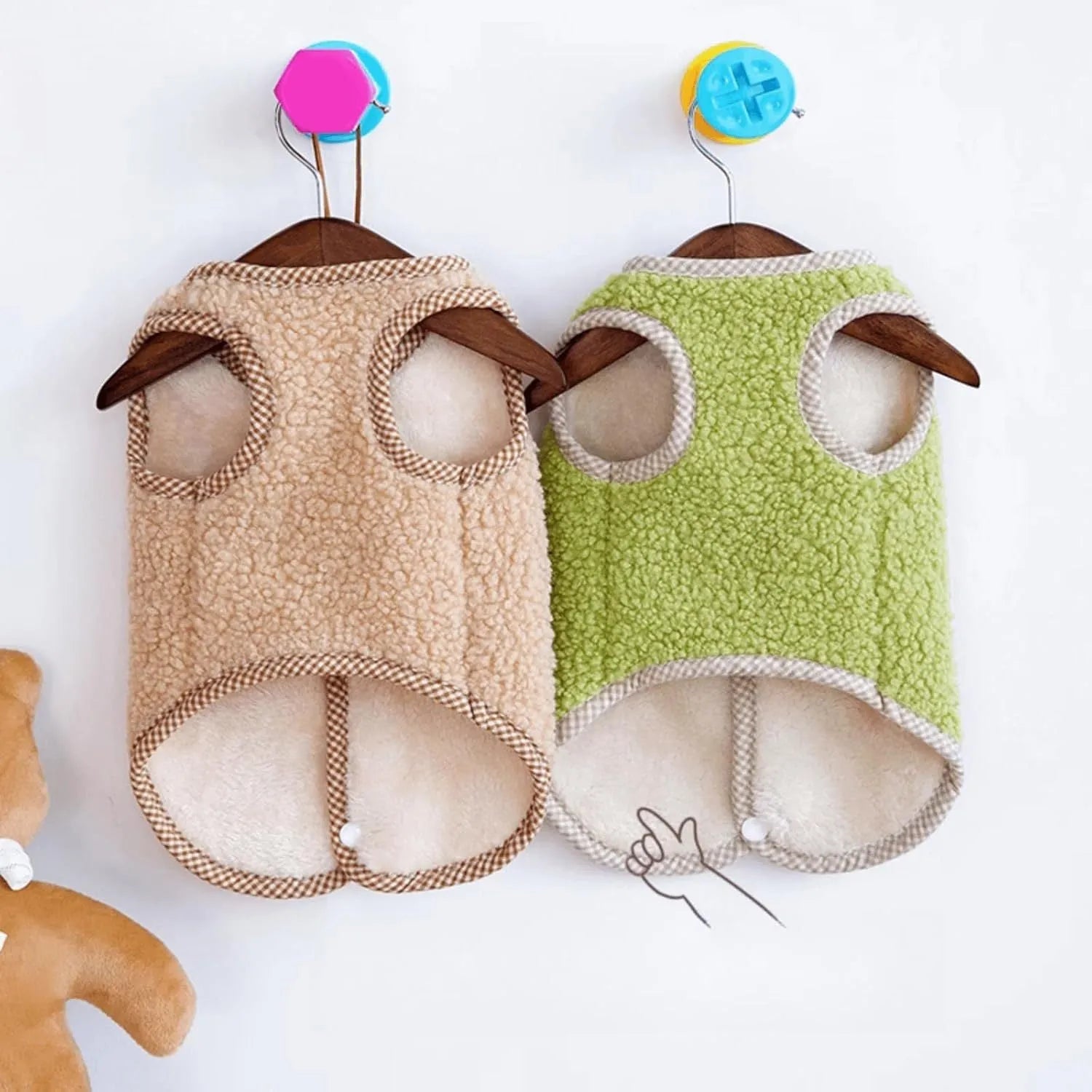 Green thickened coral fleece dog vest with a leash ring on a small dog.