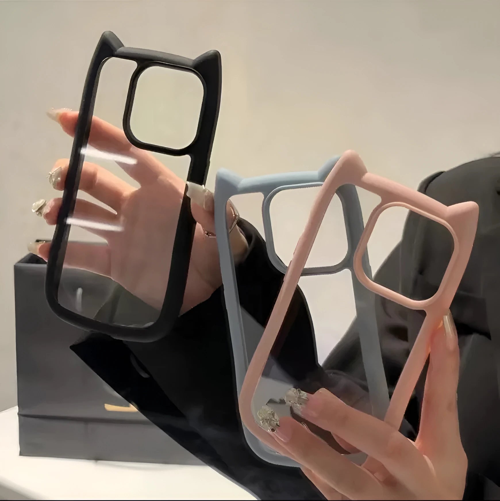 Black PC cat ears phone case for IPhone showing raised ear design and camera cutout