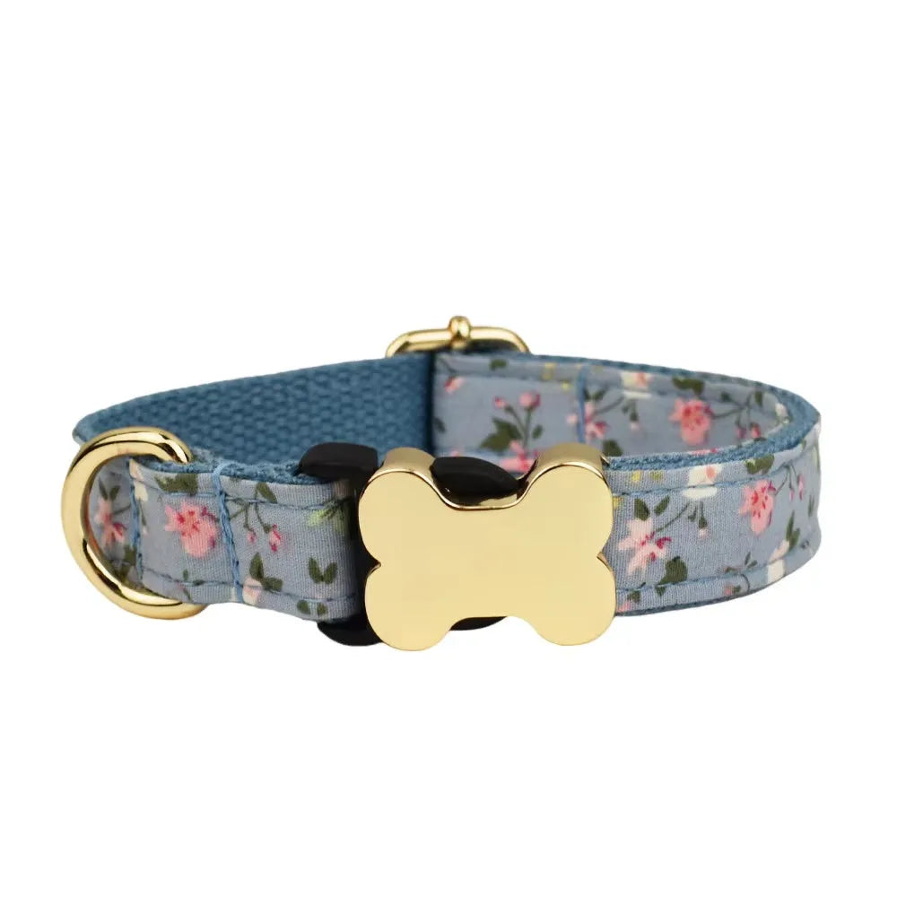 Nylon dog collar with a printed grid pattern and a large bone-shaped metal buckle.