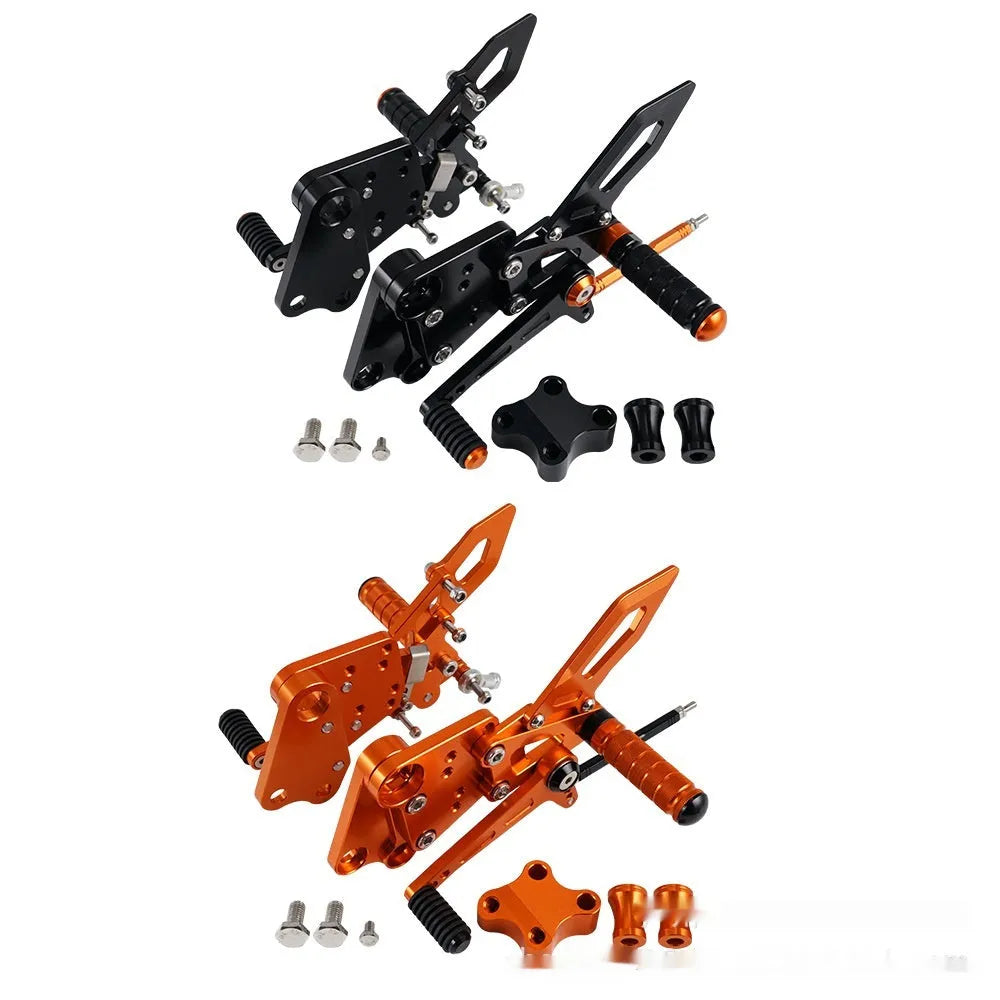 Black and orange KTM Duke motorcycle rear shift pedal support bracket assembly.