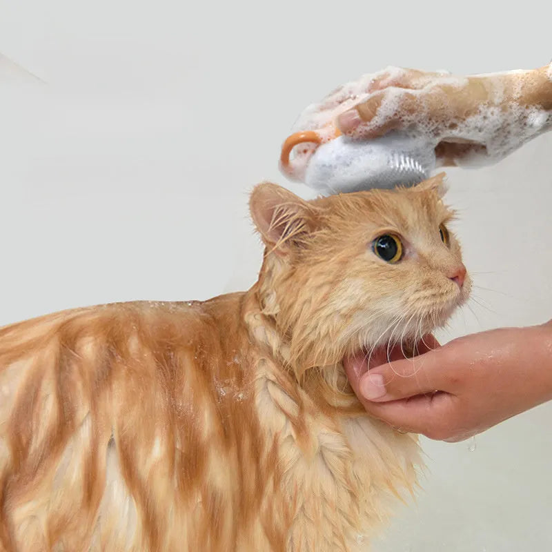 Orange TPR dog bath brush with shampoo dispenser and massage bristles