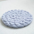 Hand-woven thermal wool pet mat in creamy white for dogs and cats, available in multiple sizes