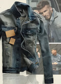 Men's straight fit cotton denim jacket in blue with chest pockets and button front on a hanger