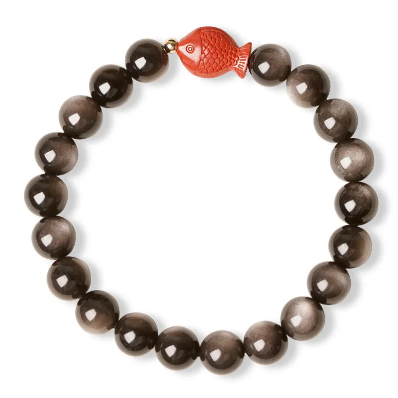 Natural obsidian bracelet with cinnabar fungal growth in round beads, showing stone patterns