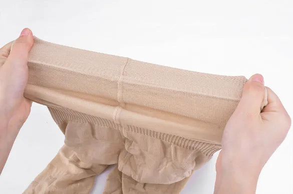 Black seamless high-waist shapewear shorts for women on a hanger.