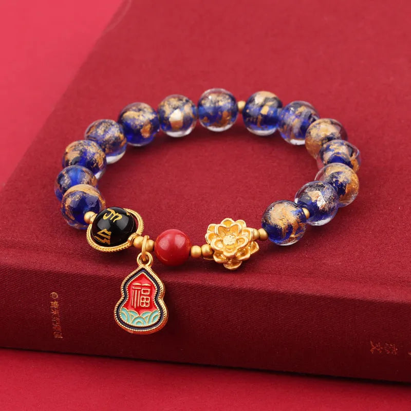 Lotus Blessing Card bracelet with 8mm glass beads, fragrant grey glaze, and gold foil electroplated accents