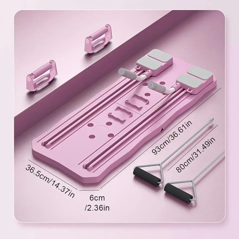 Pink portable ABS supine fitness board with a central wheel for home core exercises.