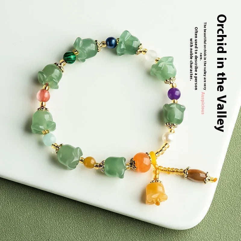 Carved natural Xinjiang Jinsi jade bracelet with aventurine orchid beads and Gobi jade topaz accents.