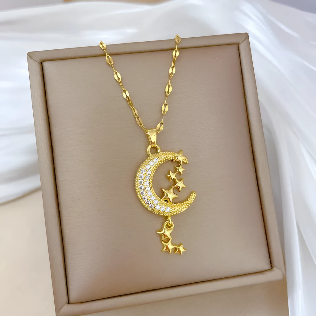 Geometric full moon pendant necklace with crystal setting and tassel on a stainless steel chain.