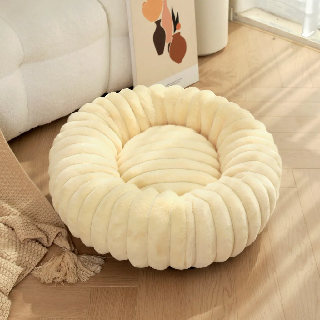 Round plush pet mat in beige, showing long-hair texture and circular shape