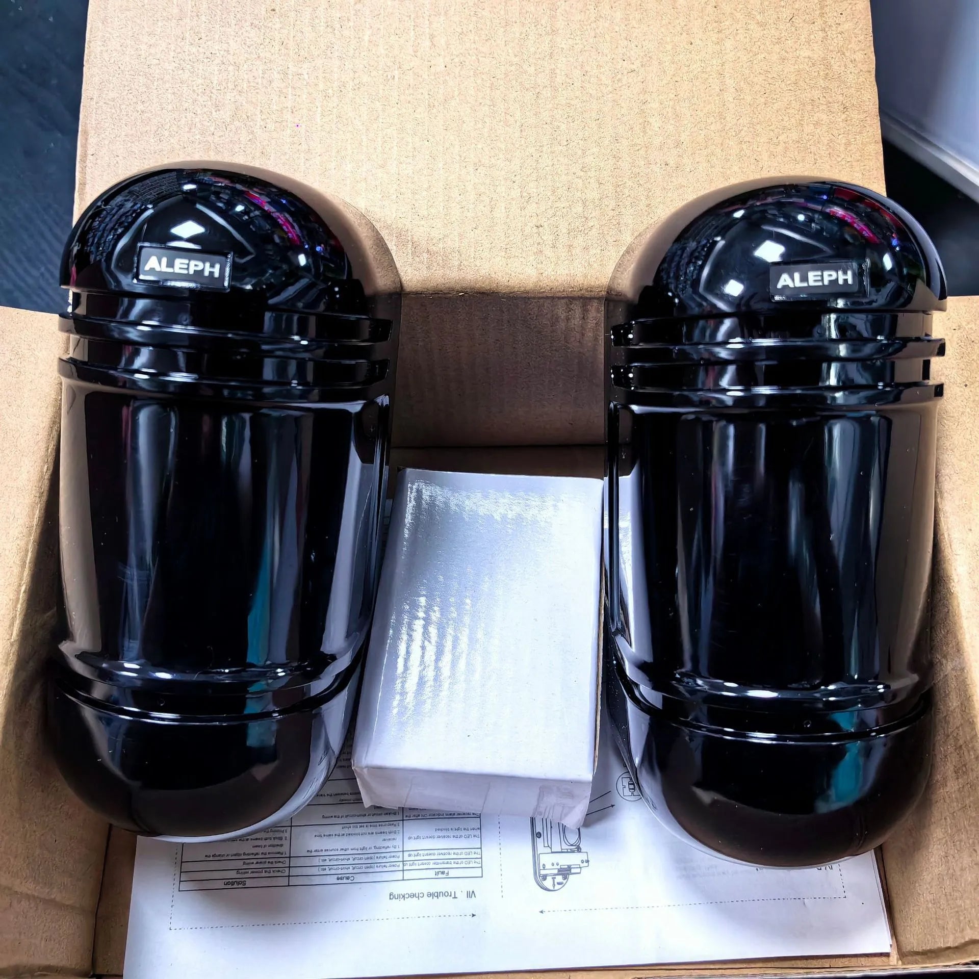 Black two-beam infrared anti-theft detector with wired connections for 150 metre security coverage