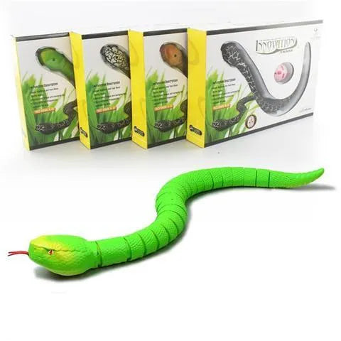 Novelty Remote Control Snake in green colour, 38 cm plastic toy with retractable tongue on a wooden floor