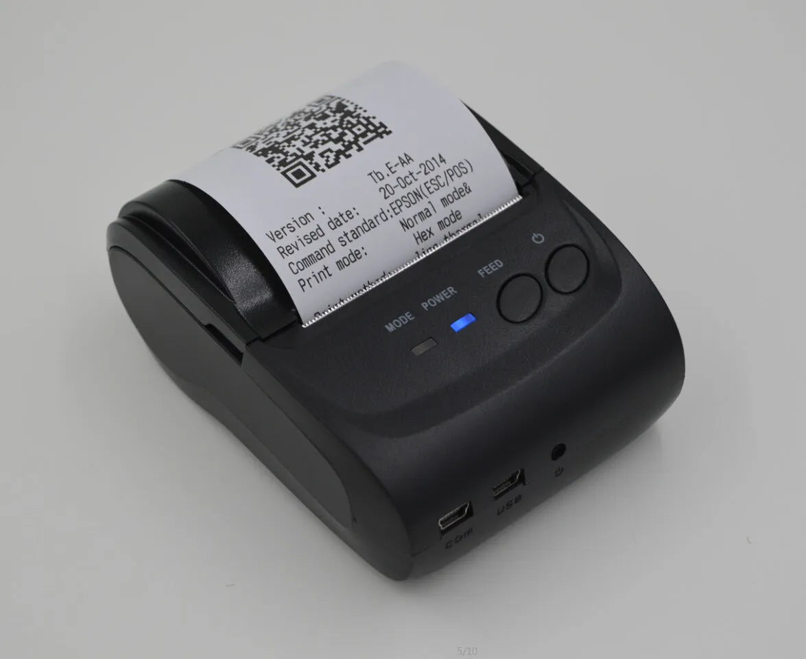 Dark gray portable Bluetooth thermal printer 104x75x45mm with USB and serial ports