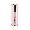 White portable USB charging mini curling iron with gold ceramic barrel on a table.