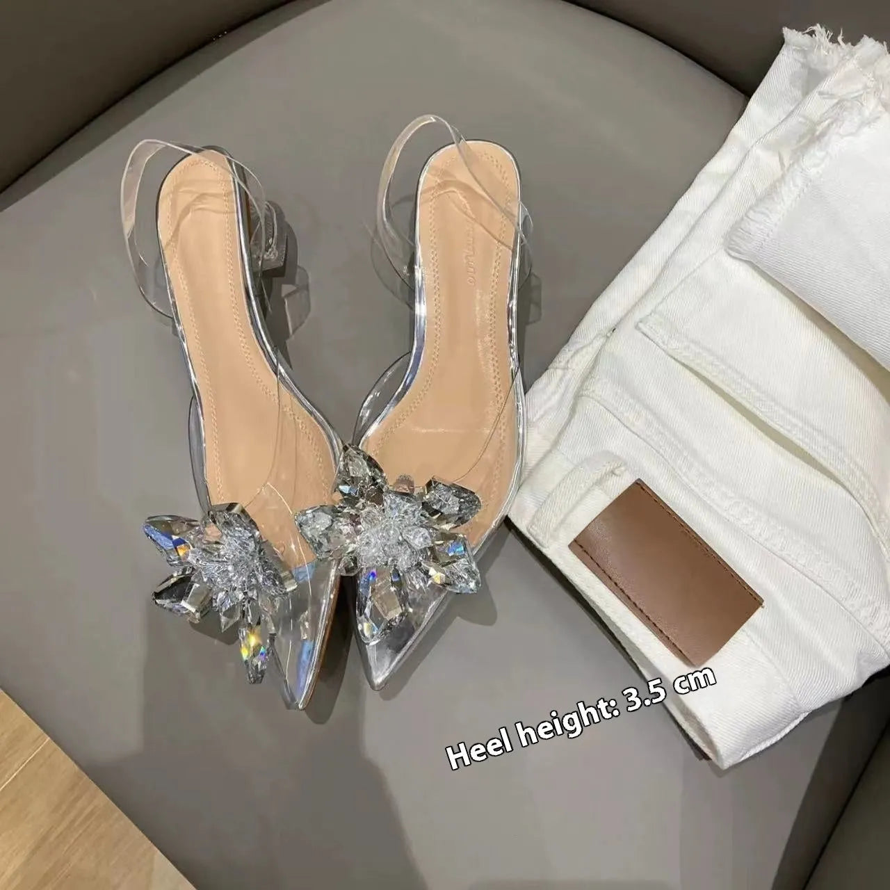 Women's transparent high heels with crystal flower detailing and pointed toe in microfiber