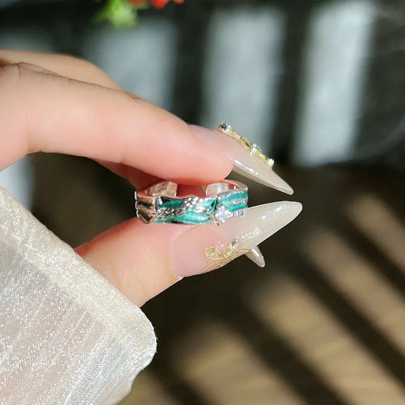 Mint green enamel copper ring with asymmetric folding design and asterism star motif