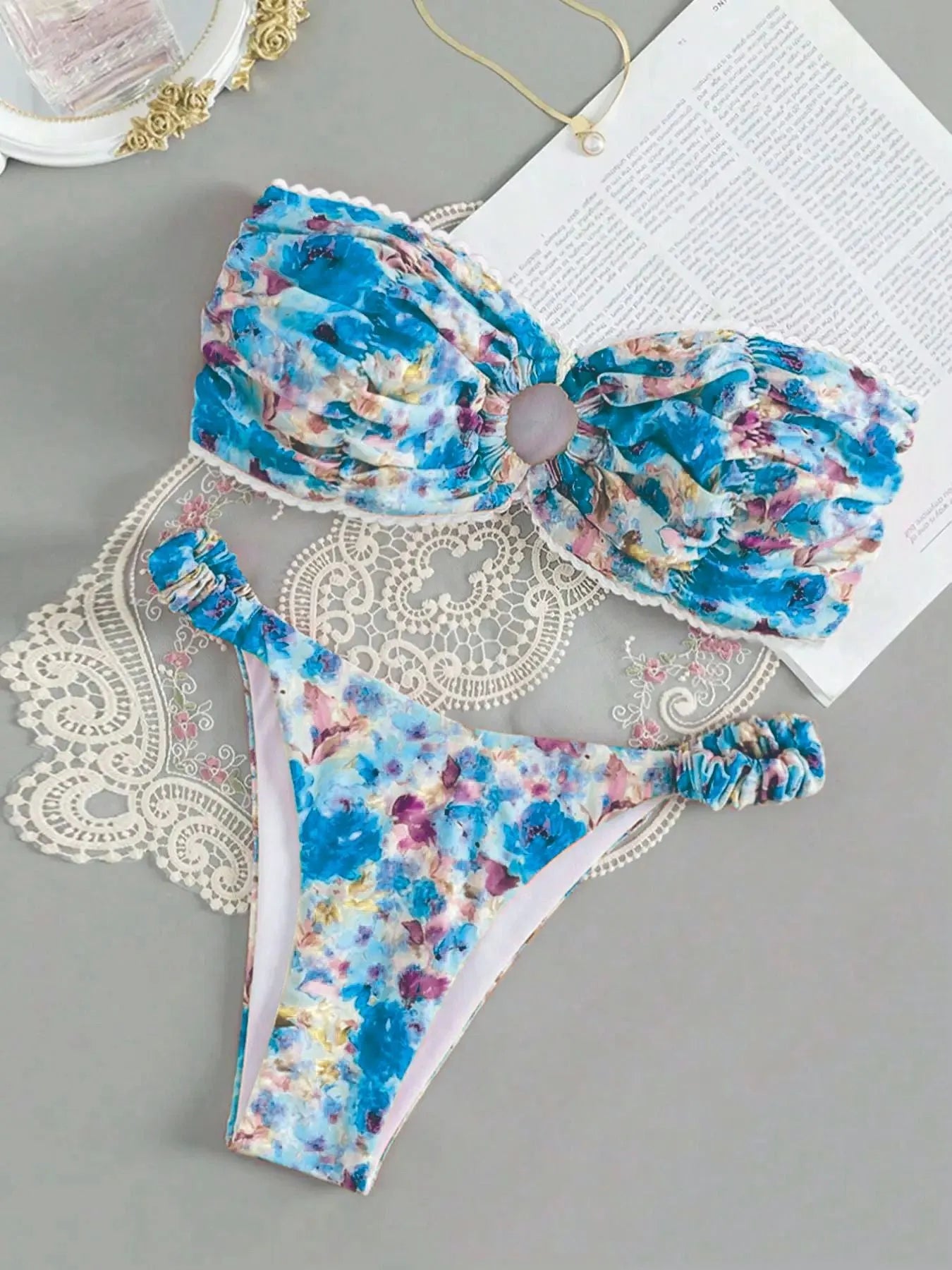 Women's polyester bikini set with floral print tube top and matching briefs for swimming.