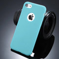 Soft silicone TPU iPhone case in candy colours including pink, blue and red on a plain background
