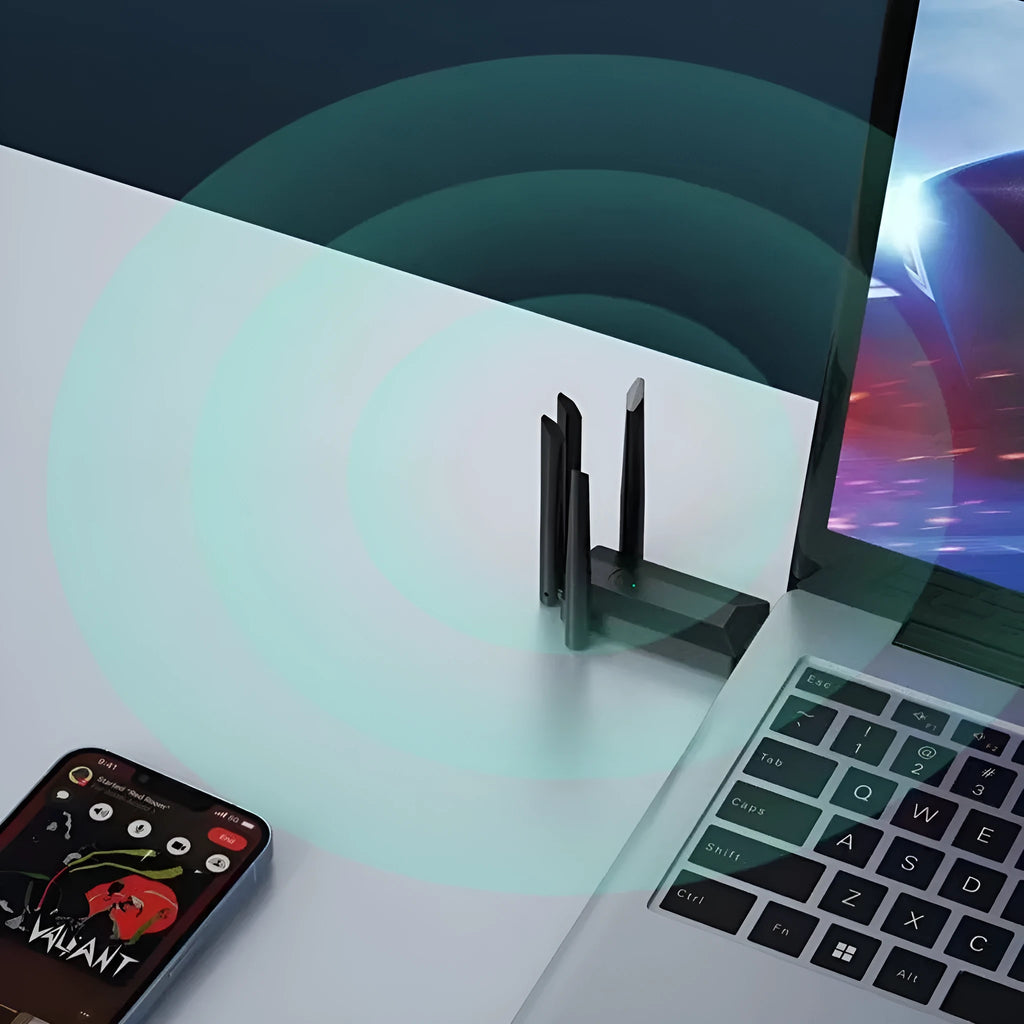 Black external USB network transmitter device with four extended antennas.