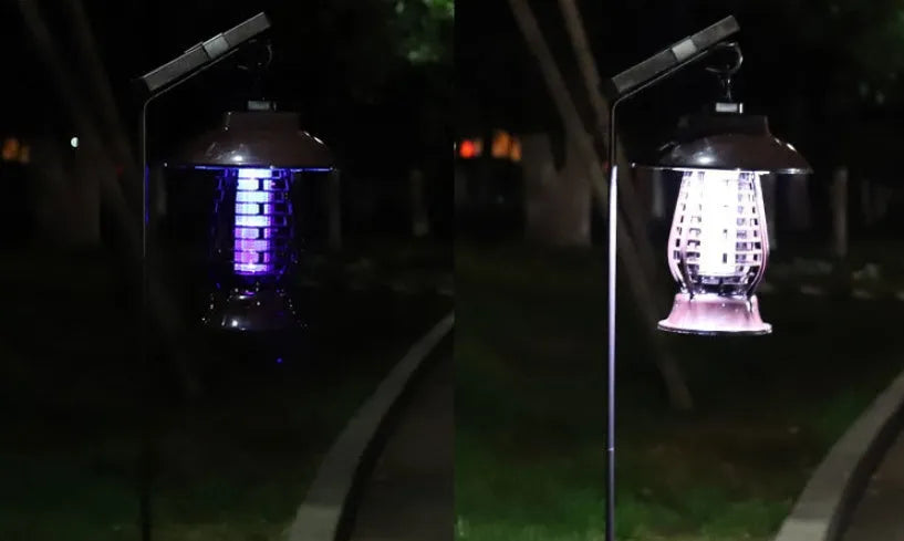 Black solar mosquito lamp with solar panel on top and LED lights for garden insect control
