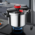 Stainless steel stovetop pressure cooker with a black handle and three-speed pressure lid on a kitchen counter.