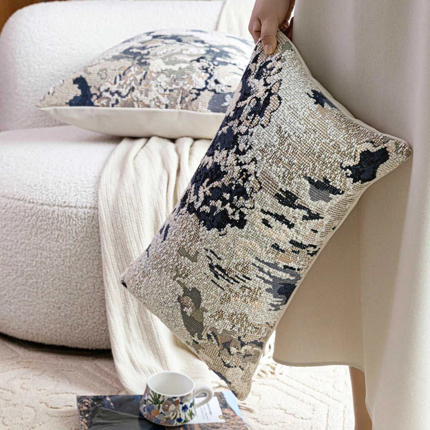 Antique blue wool blend decorative pillow with abstract flower pattern in square and waist pillow sizes.