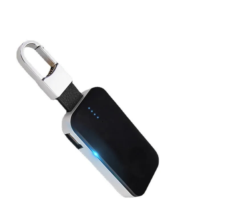 Black Apple Watch wireless keychain power bank showing compact size and charging surface.