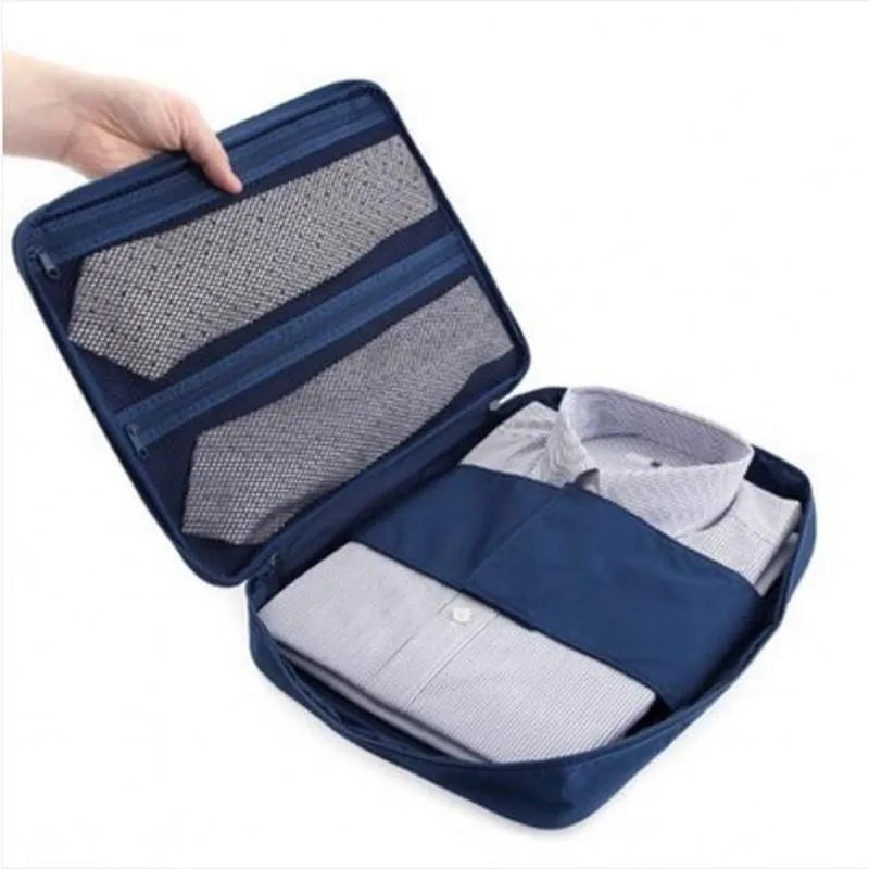 Nylon business travel organiser handbag in navy with multiple compartments for laptop and documents