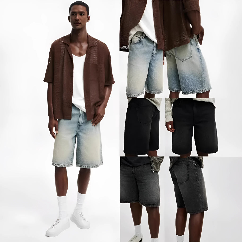 Men's loose fit light blue straight leg denim jeans on a grey background