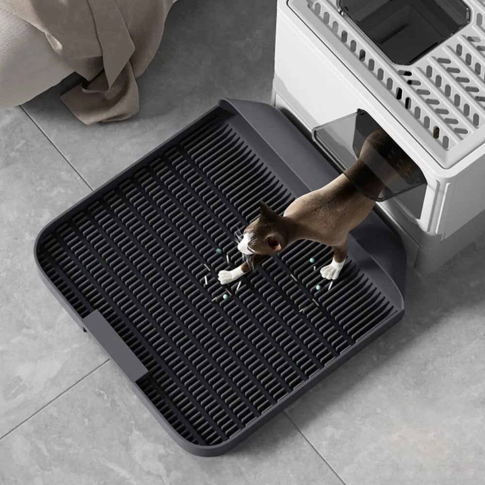 Large square black cat litter pedal mat with slanted design and textured grooves