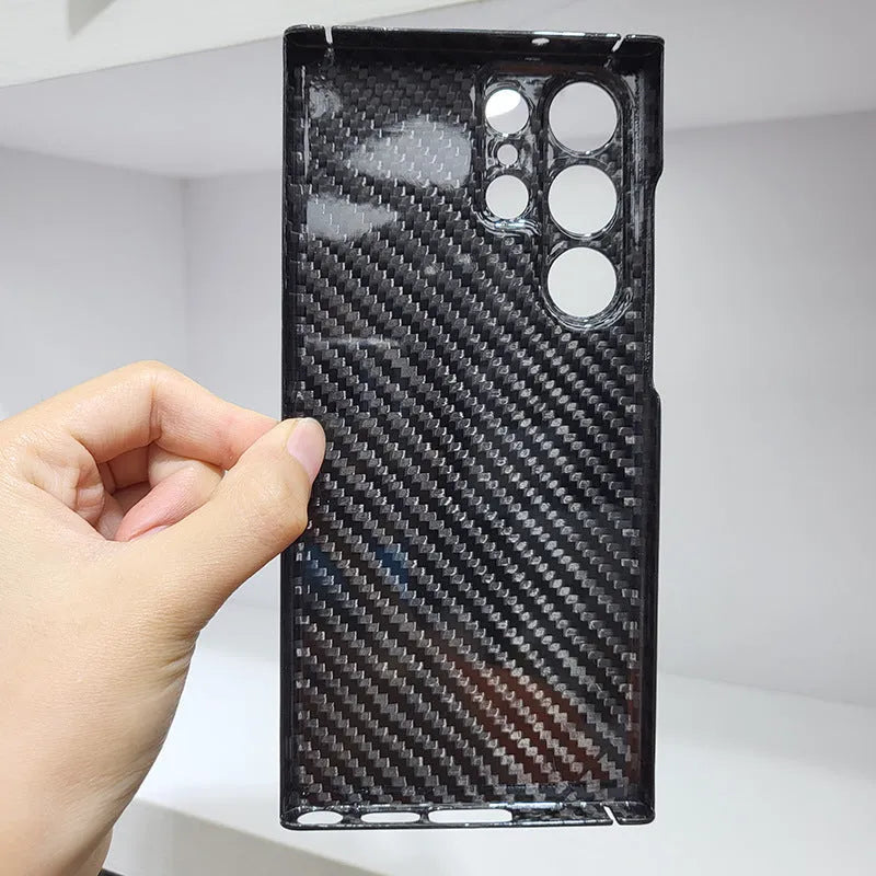 Forged carbon fibre phone case with gold foil finish for Samsung S25 Ultra, displayed on a white background