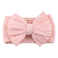 Handmade stretchy nylon baby headband with bow on newborn girl