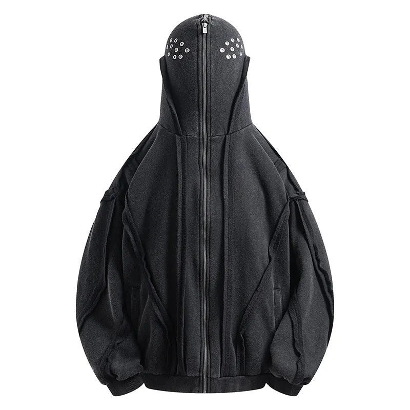 Man wearing a black loose-fit retro zip hooded coat with an abstract pattern.