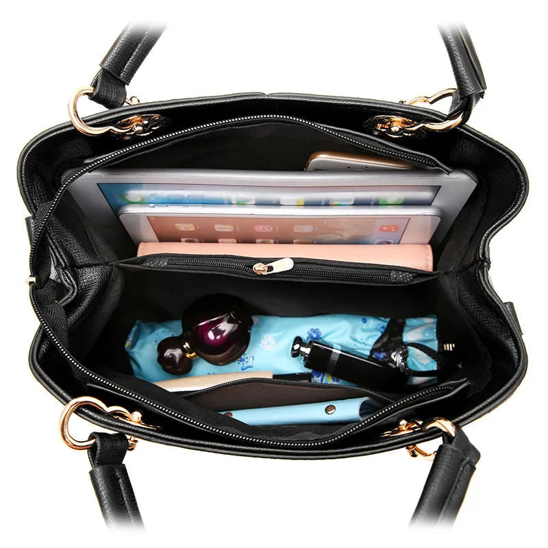 A structured navy blue PU leather crossbody bag with a gold zip, shown on a model with an adjustable shoulder strap.