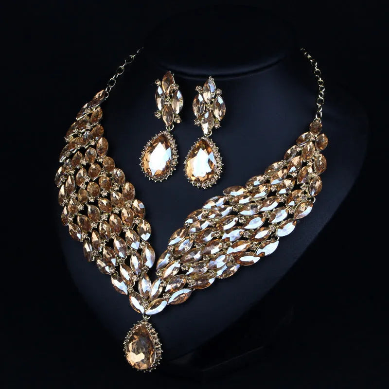 Full drill bridal clavicle chain necklace set with matching accessories in champagne and green on white background