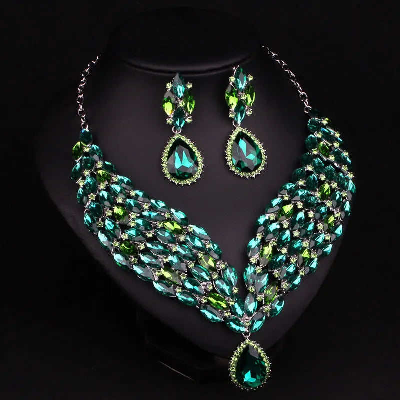 Full drill bridal clavicle chain necklace set with matching accessories in champagne and green on white background