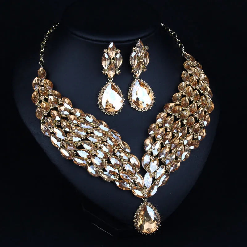 Full drill bridal clavicle chain necklace set with matching accessories in champagne and green on white background