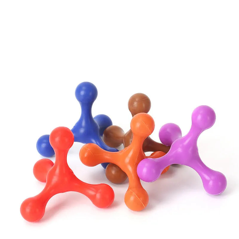 Blue silicone dog chew toy shaped like a bone with three legs, shown next to a small puppy.