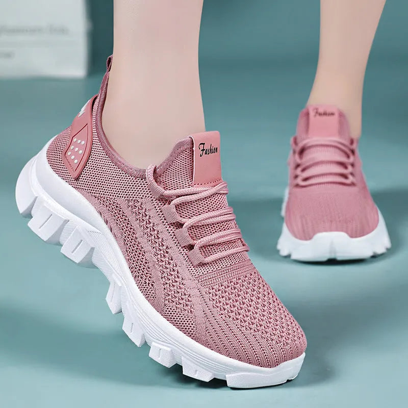 Men's white Flyknit running sneakers with thick PVC sole and lace-up front.