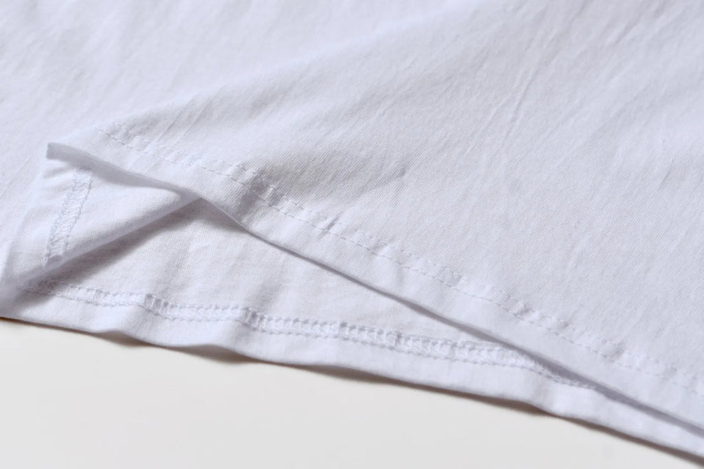 White cotton t-shirt overalls with round neck and short sleeves in loose fit