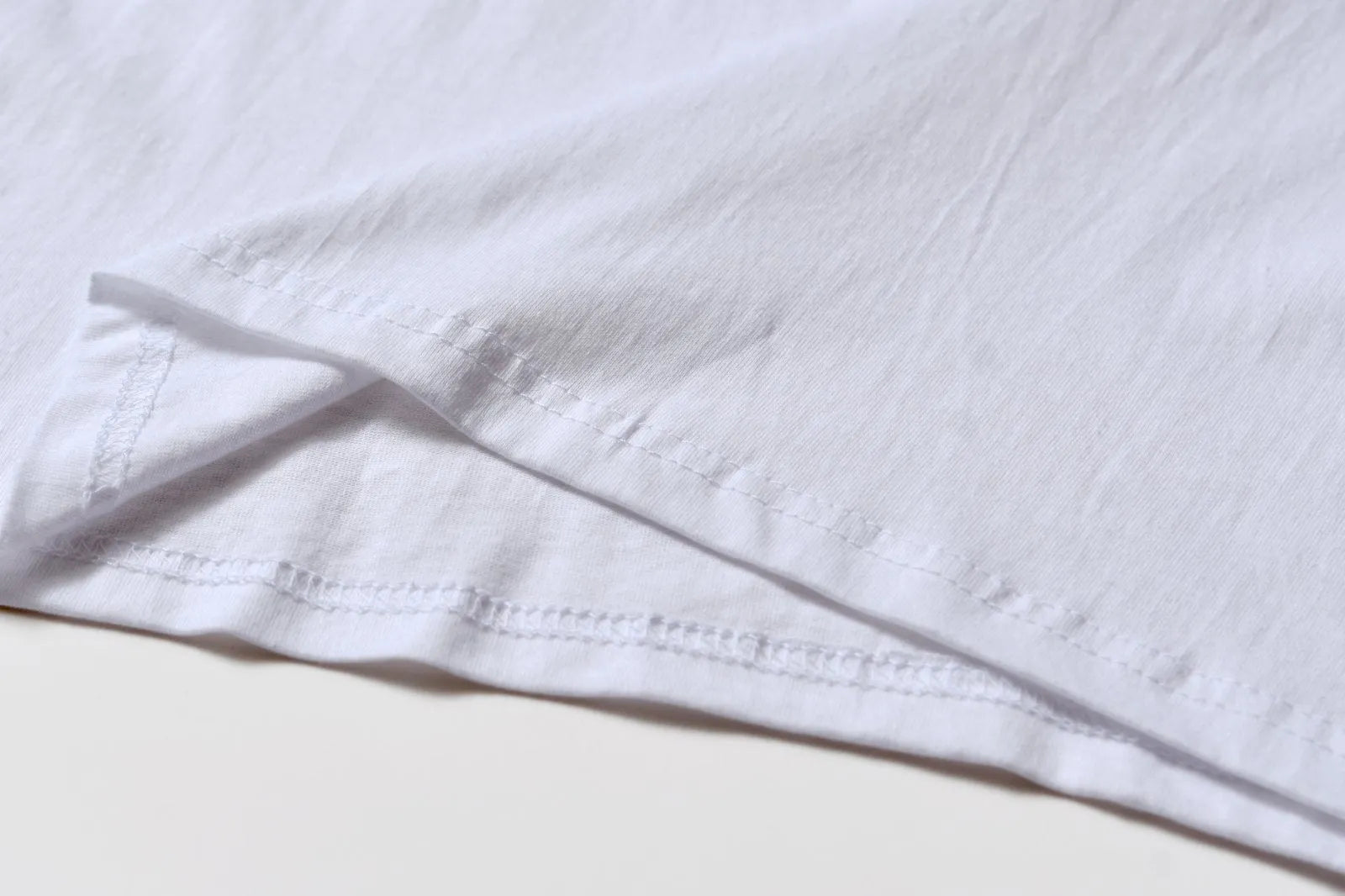 White cotton t-shirt overalls with round neck and short sleeves in loose fit