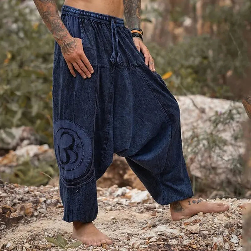 Dark green men's trousers with ethnic pattern and adjustable ankle ties